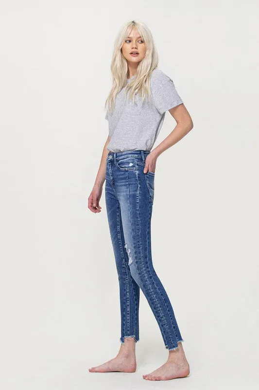 HIGH RISE ANKLE SKINNY WITH UNEVEN HEM DETAIL