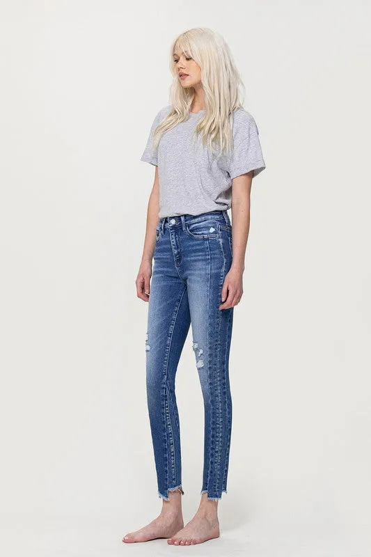 HIGH RISE ANKLE SKINNY WITH UNEVEN HEM DETAIL